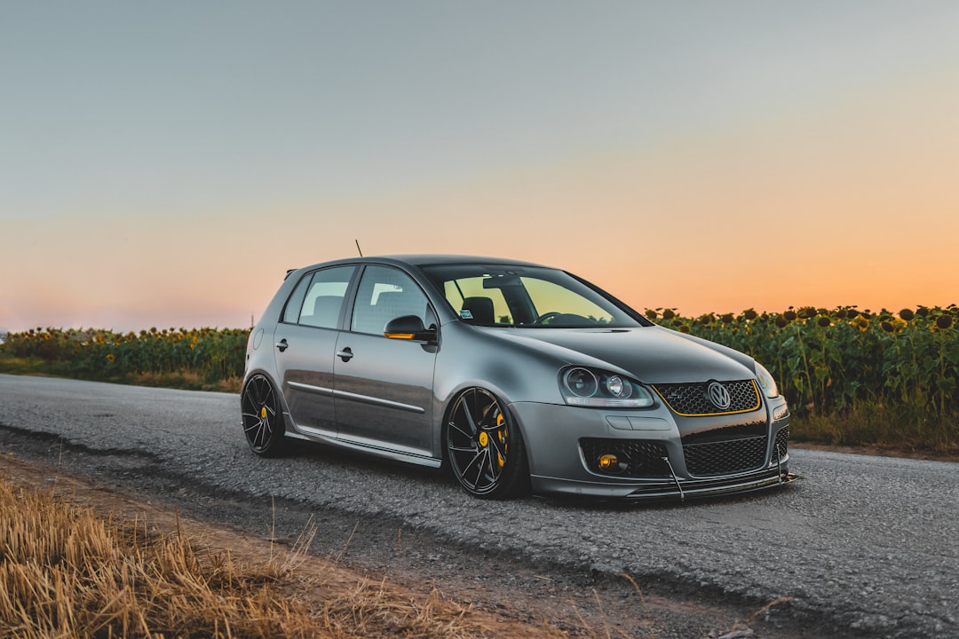 gray 5-door hatchback on road,