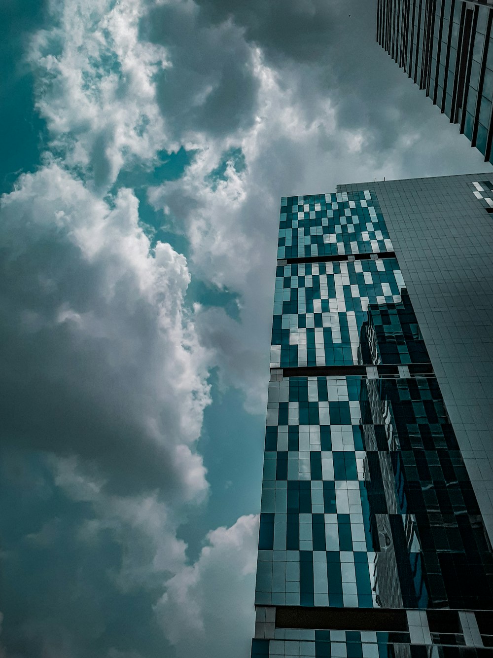 gray curtain wall building during daytime