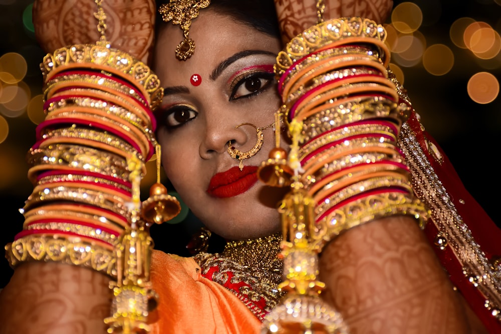 women's gold-colored bangles