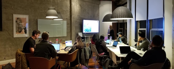 people sitting and using laptops