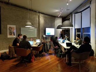 people sitting and using laptops