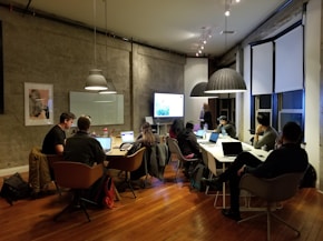 people sitting and using laptops