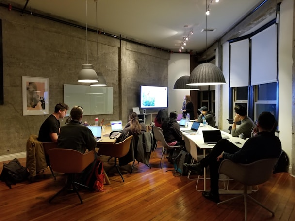 people sitting and using laptops