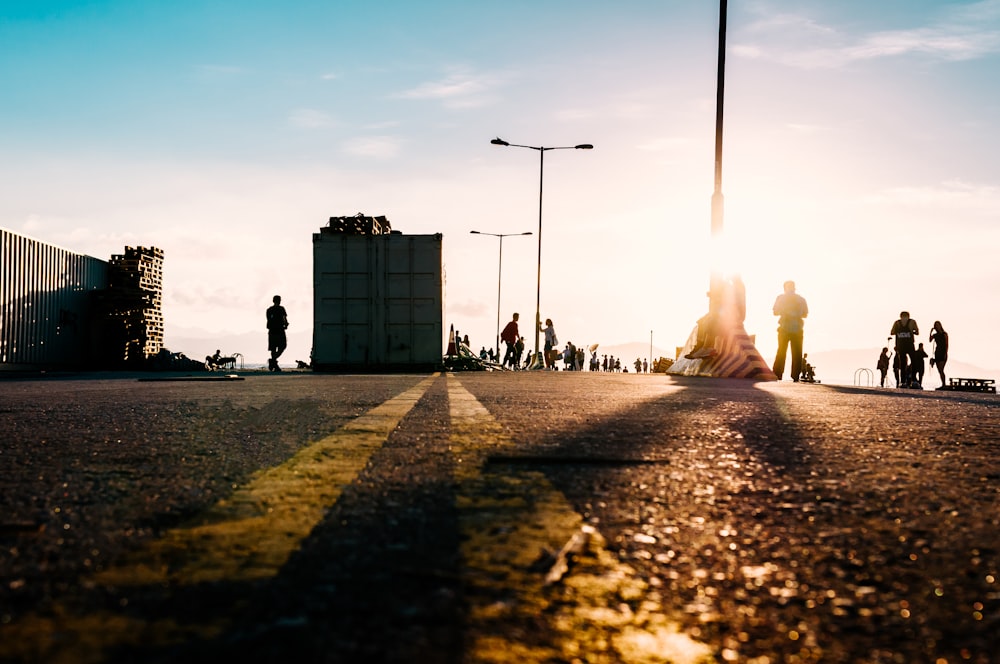 people walking on road near buildings