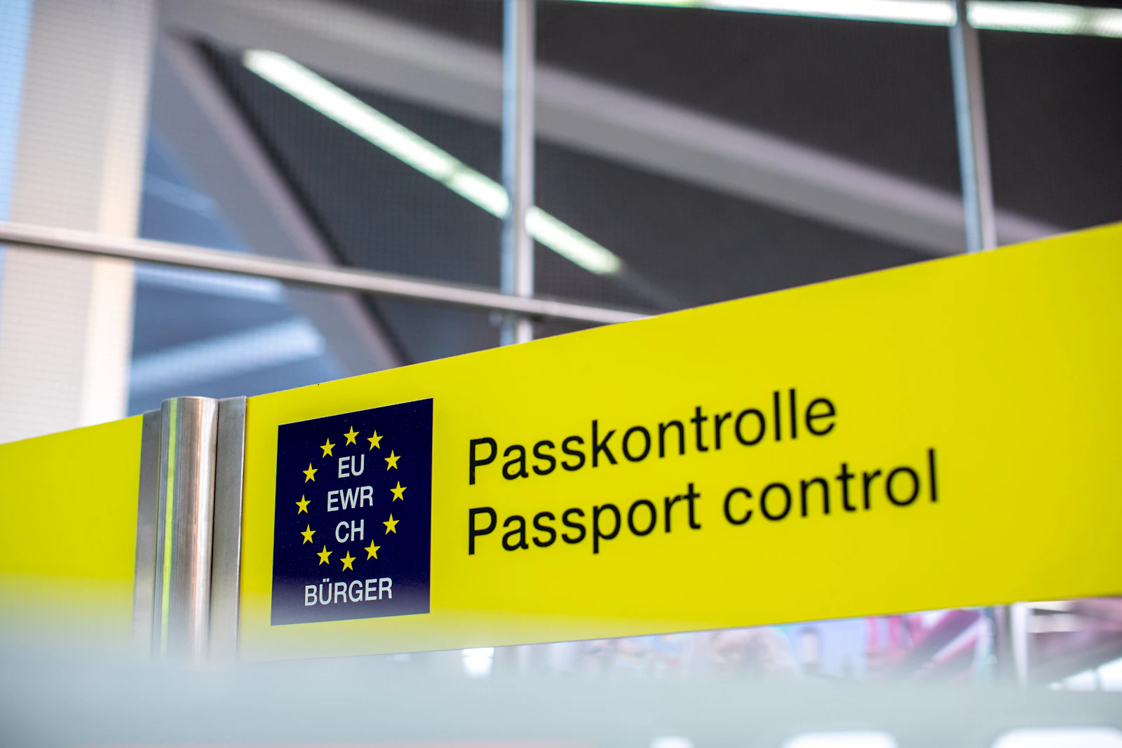 European passport-control sign inside an airport