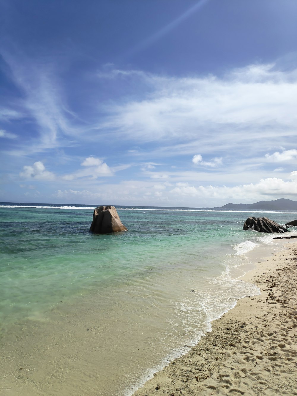 seashore under blue sky during daytime