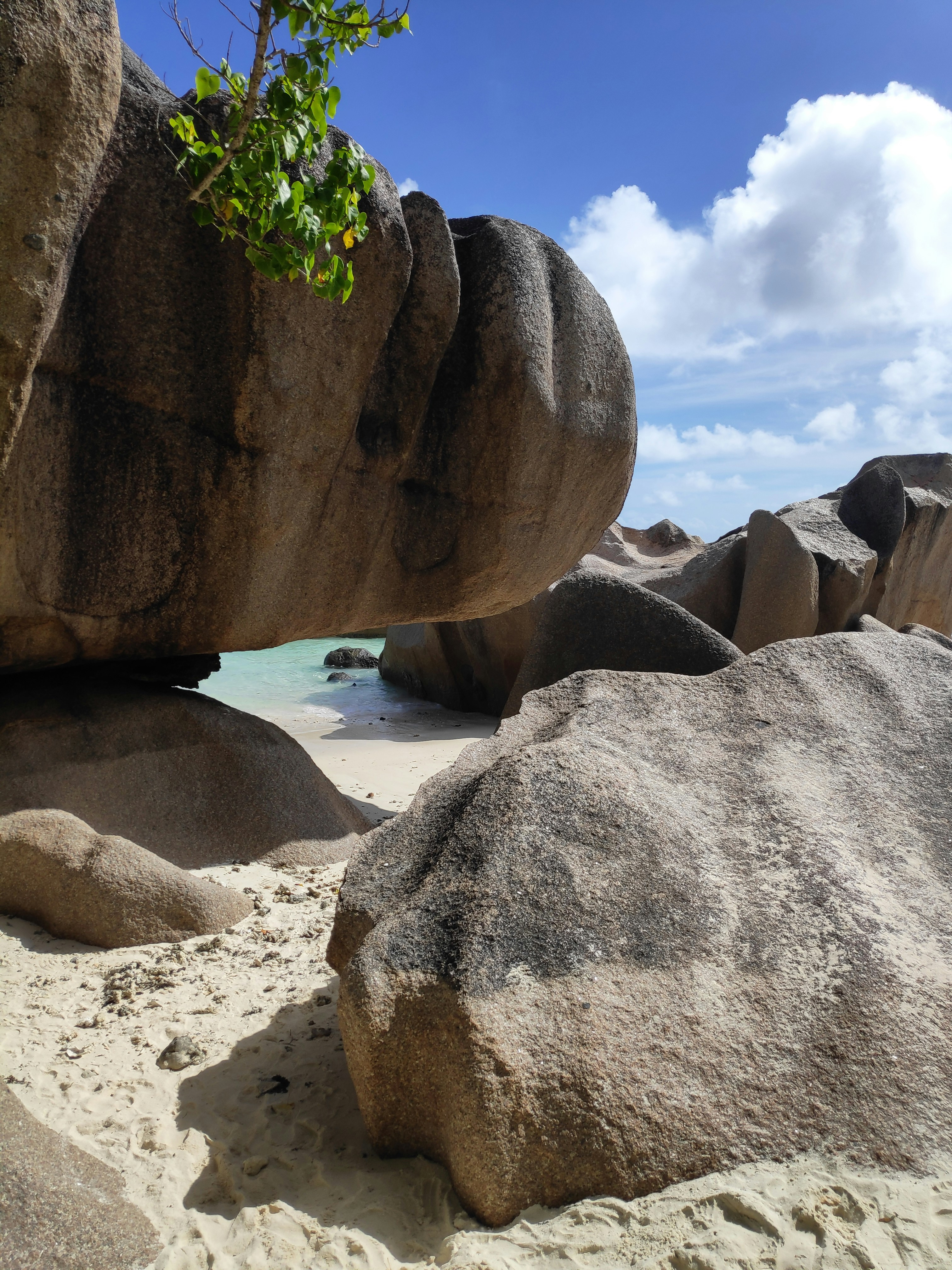 Granite rock formations and clear sea at La Digue, Seychelles