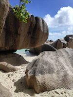 gray and black rock formations under white and blue sky at daytime