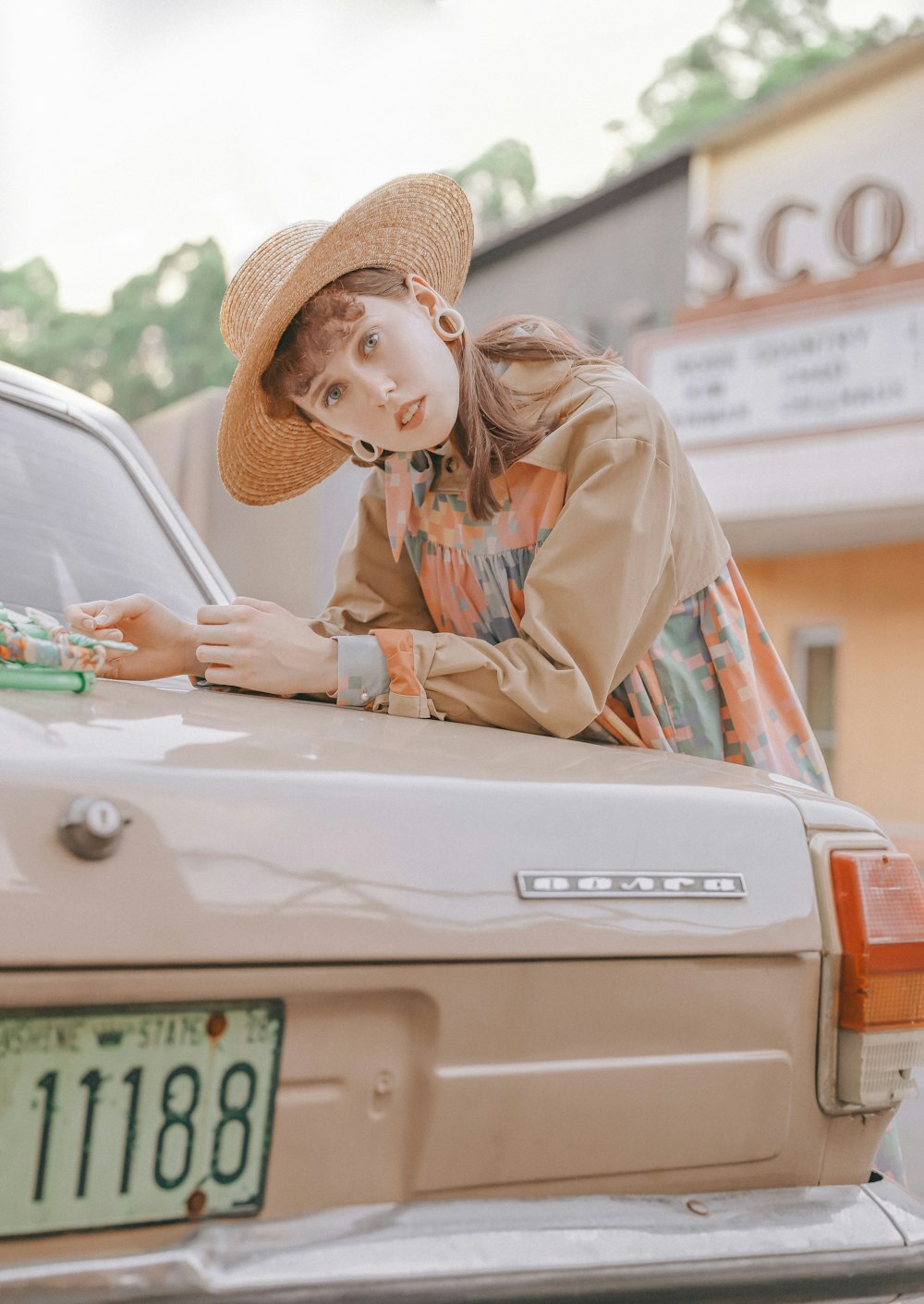 woman standing beside park vehicle