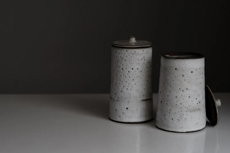 White marble salt and pepper shakers on a dinner table