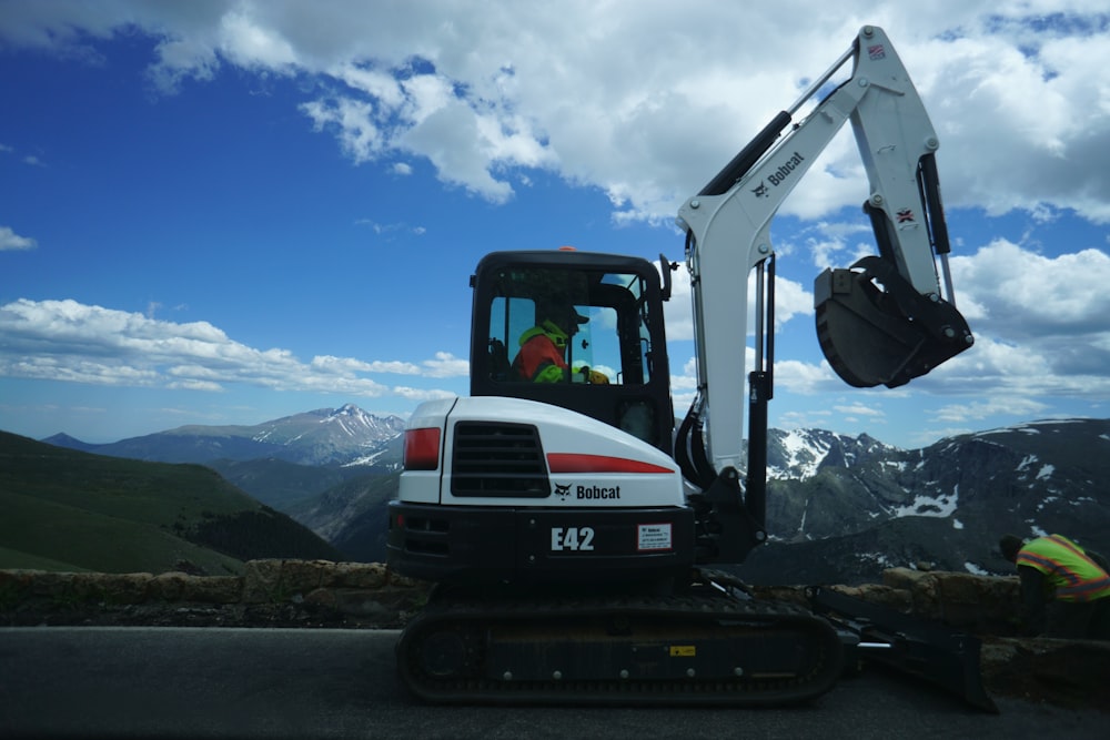 white and black excavator