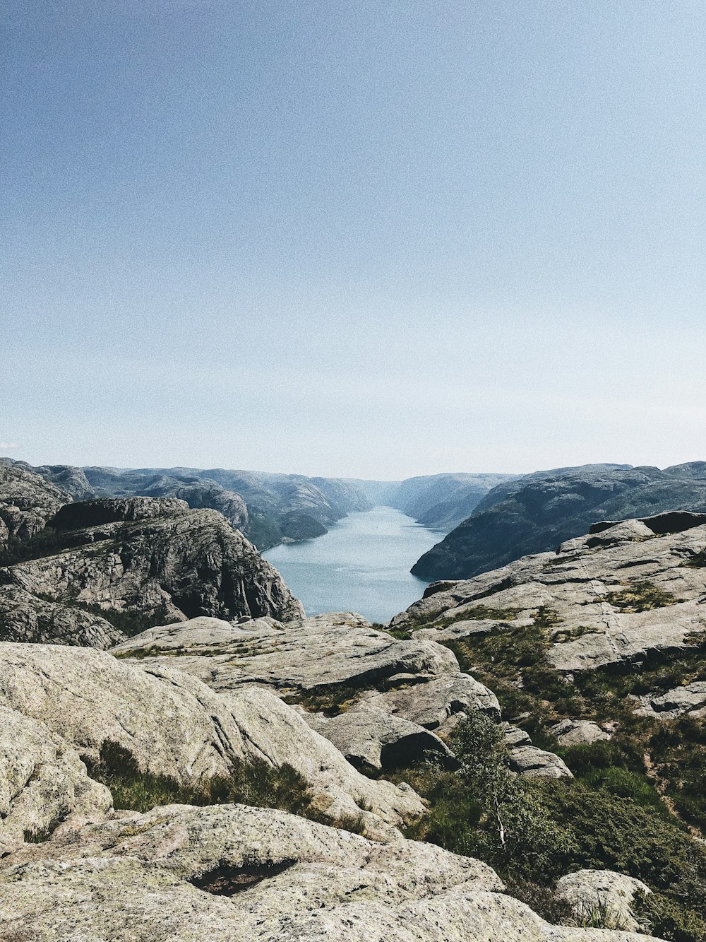 photography of river and mountain range during daytime