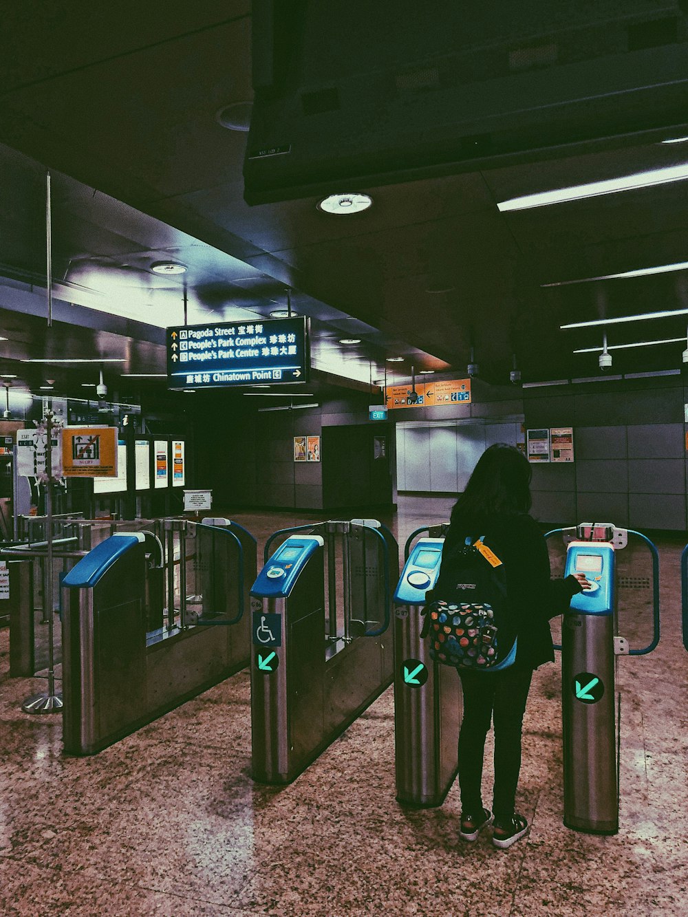 woman standing beside stand