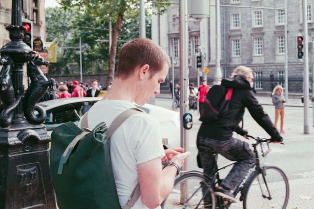 man wearing green backpack