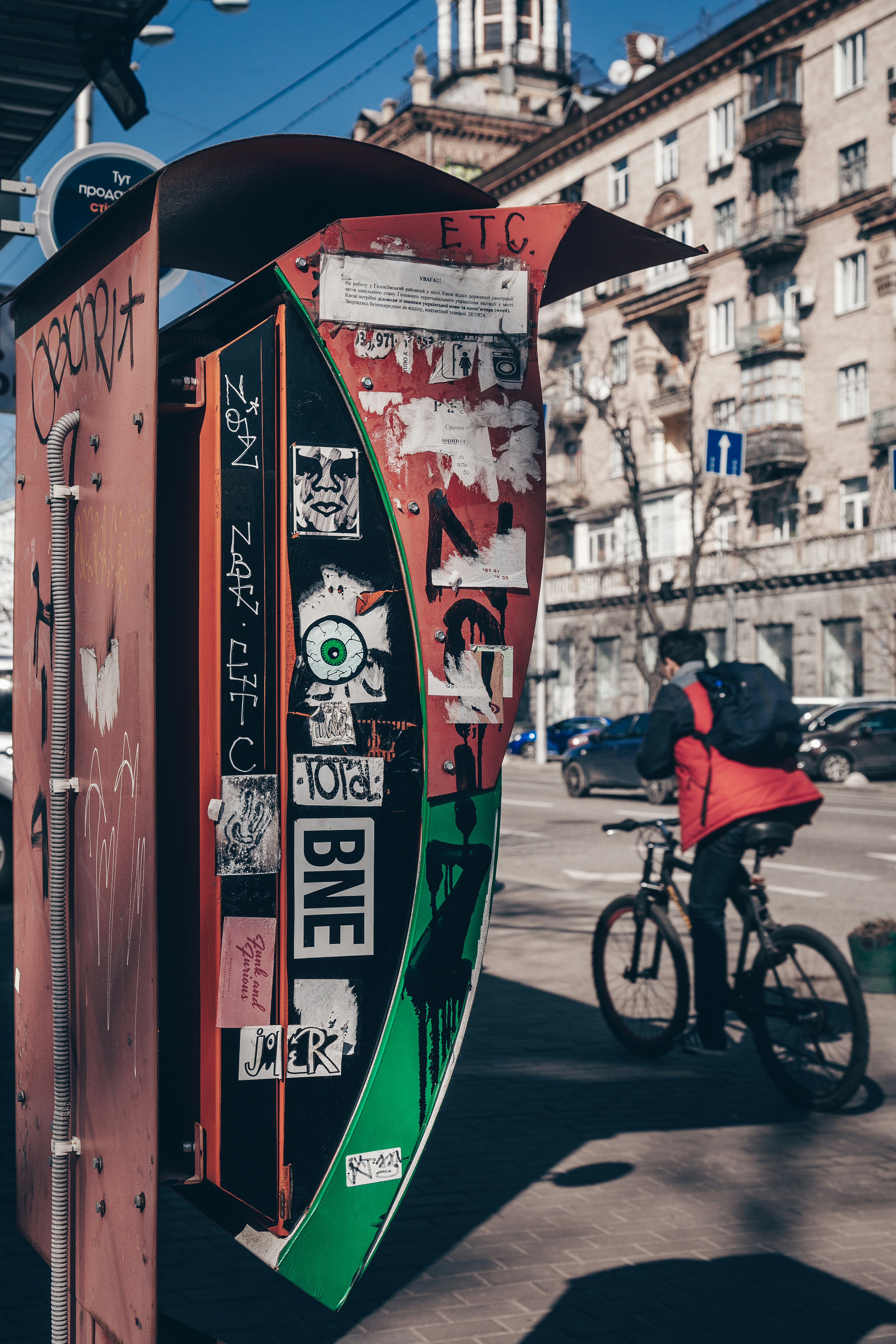 photography of man riding bicycle near road