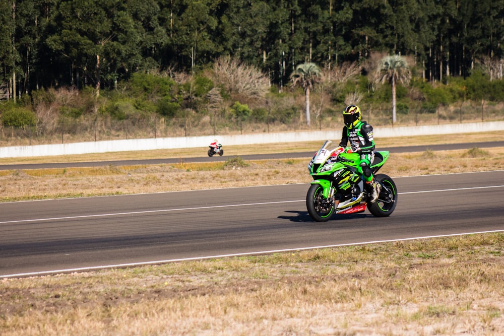 green and black sports bike