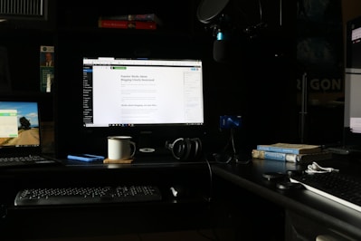A serene workspace with a laptop displaying a blog post on mindfulness and technology.