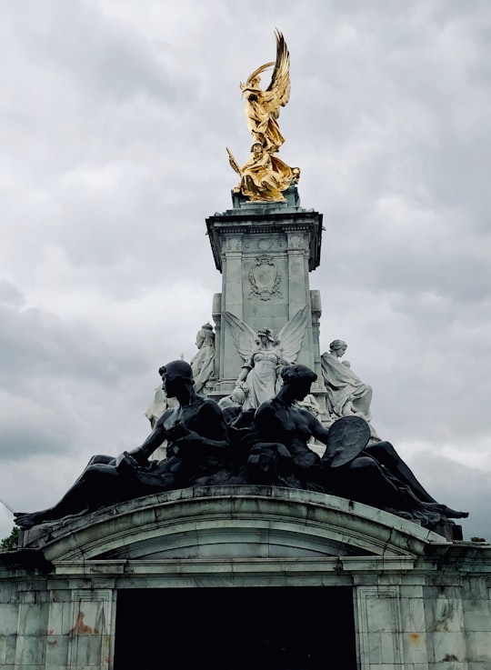 close-up photography of human statue during daytime in Victoria Memorial United Kingdom