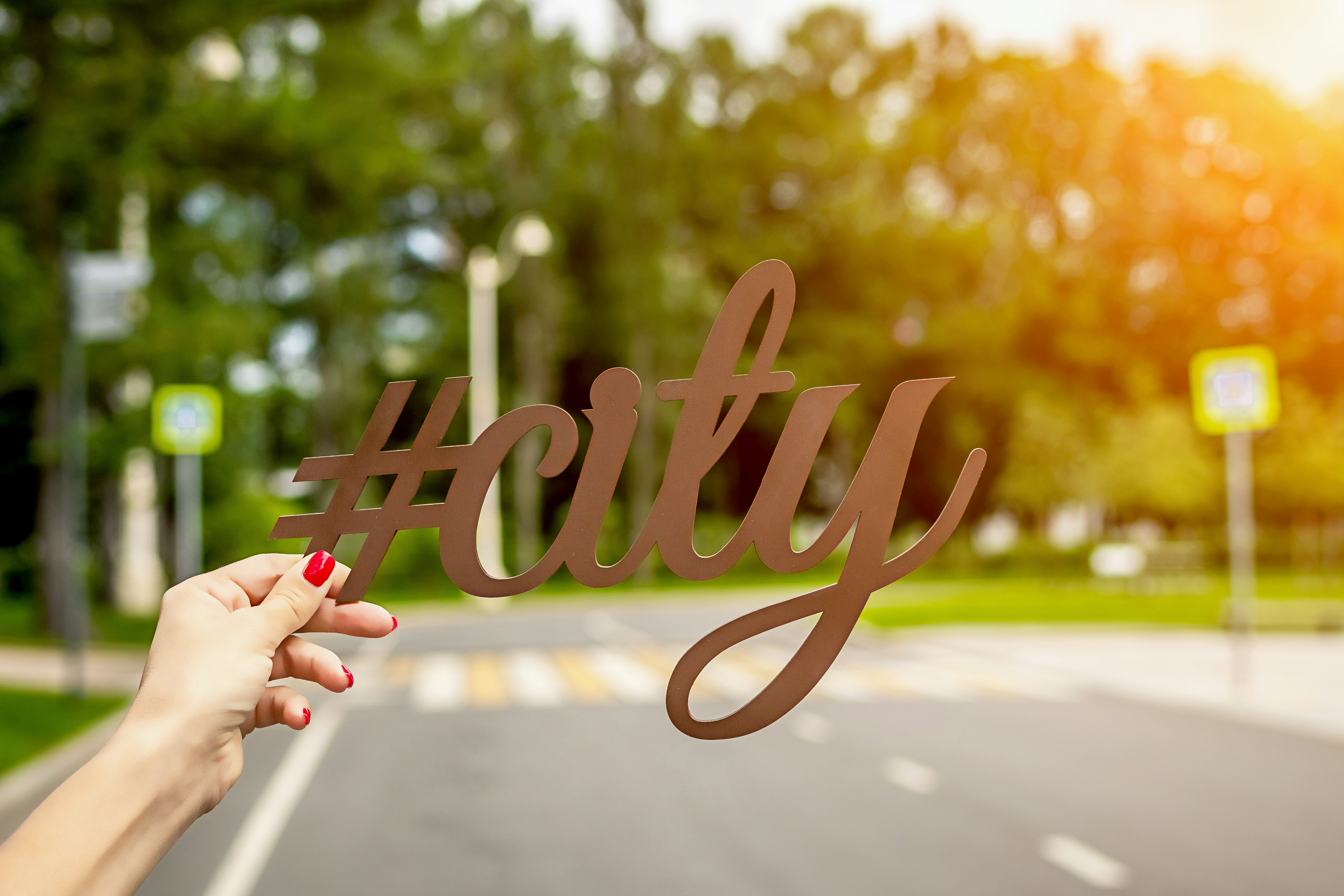 person holding #City cutout letter