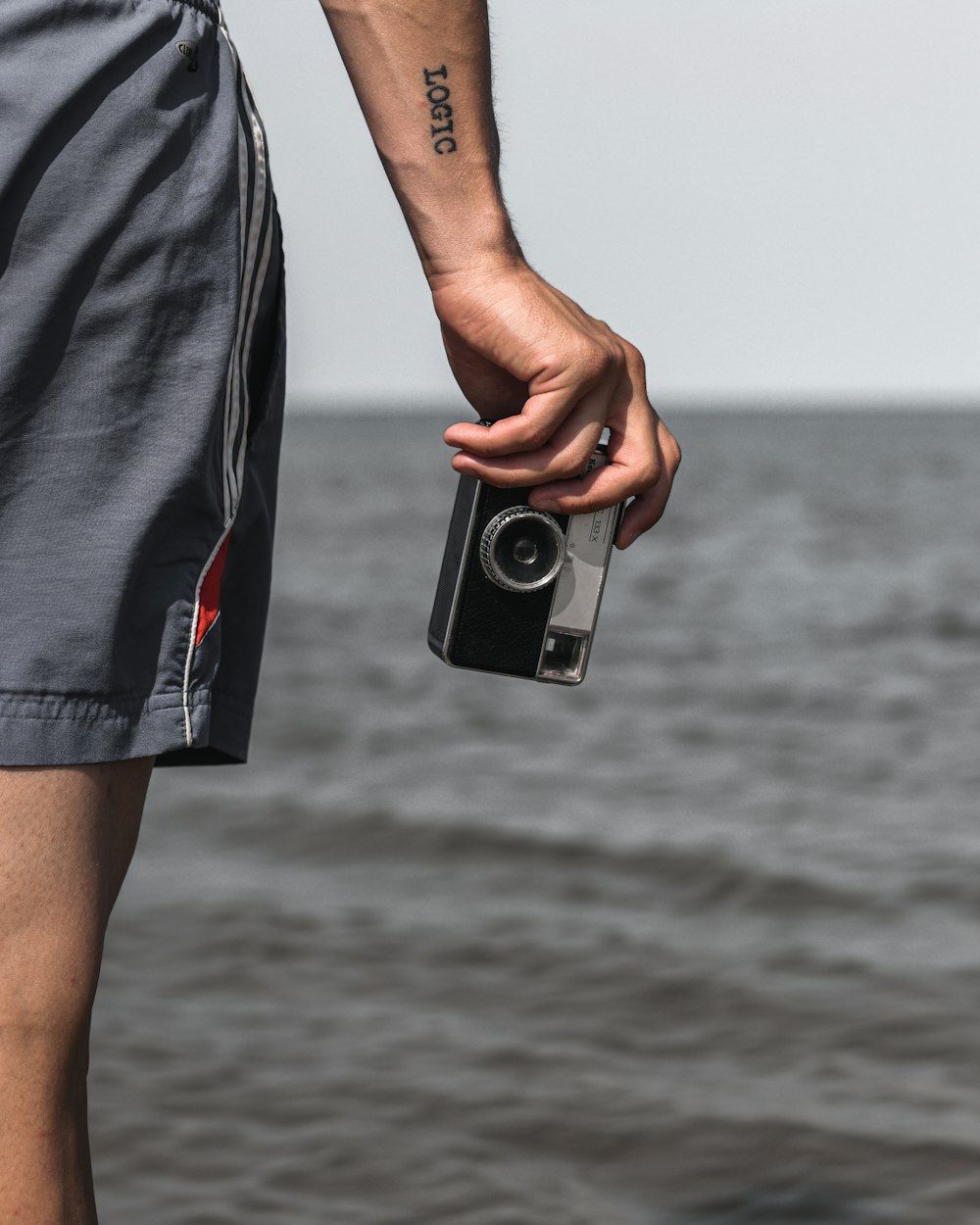 person holding digital camera