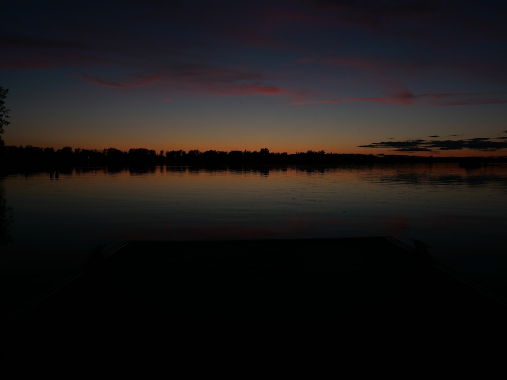 landscape photograph of body of water during dawn