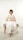 woman sitting on ottoman