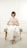woman sitting on ottoman