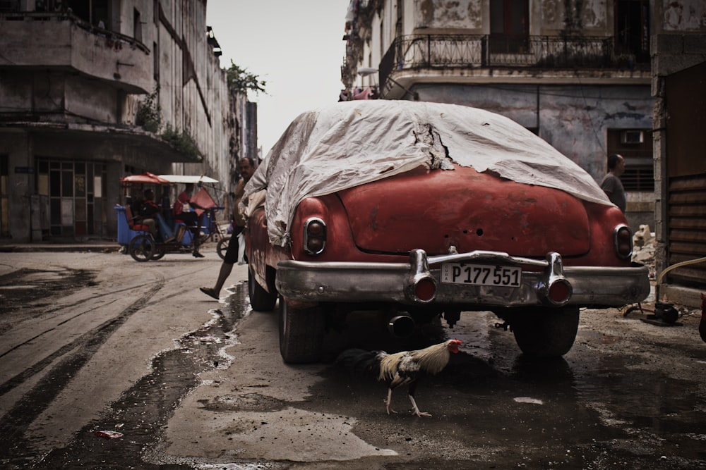 photo of red classic car