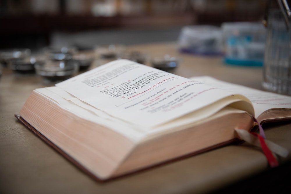 opened book on wooden surface