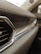 Close-up of a sparkling clean car dashboard and leather seats after detailing.