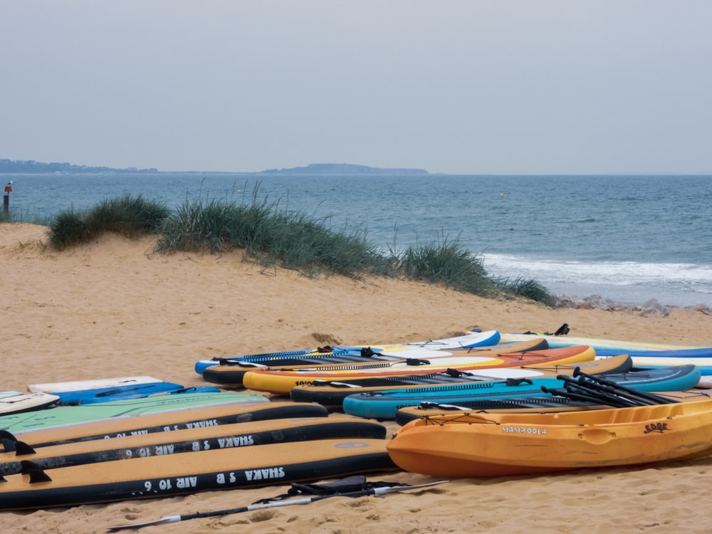 pile of assorted-color kayaks