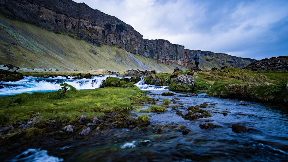 body of water near mountain