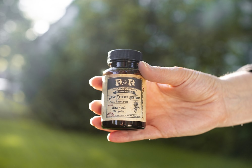 person holding R&R bottle