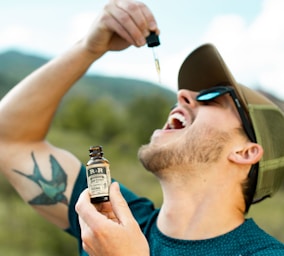 man drinking from droplet