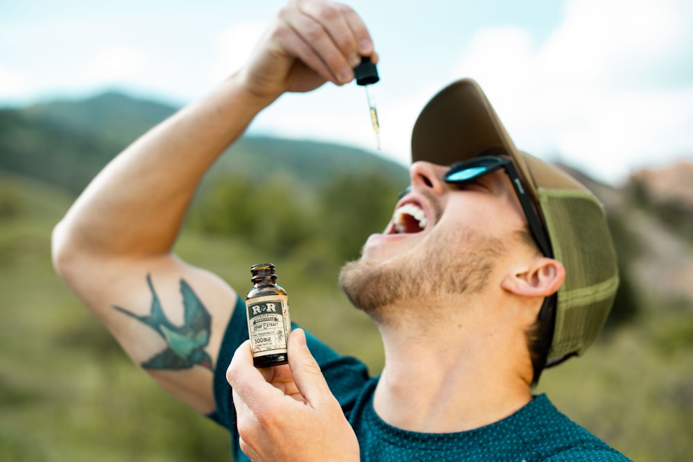 man drinking from droplet