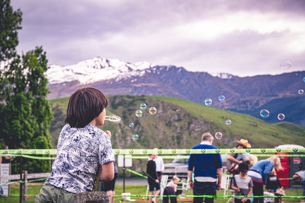 boy's blowing bubbles