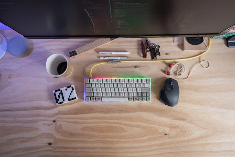 white computer keyboard beside mouse