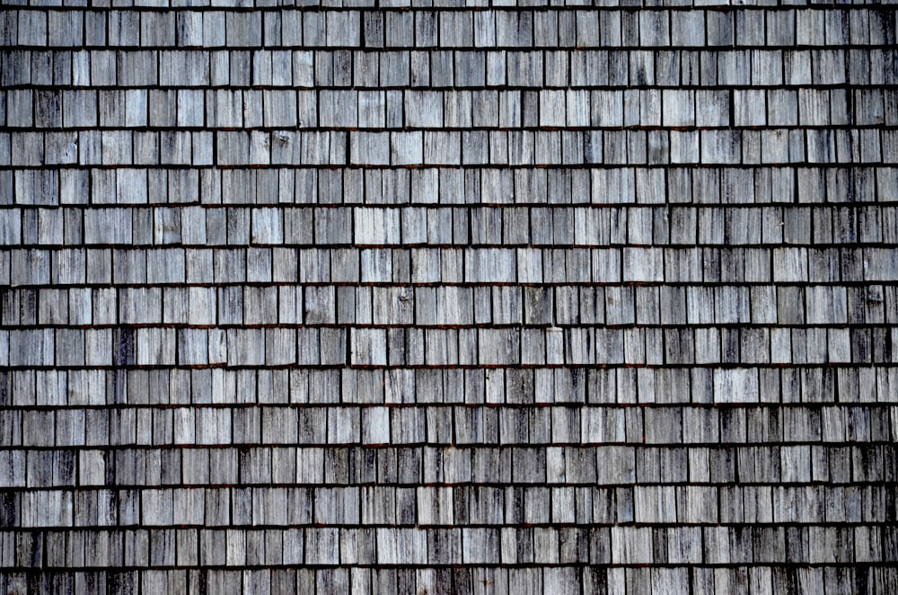 a close up of a roof made of wood shingles