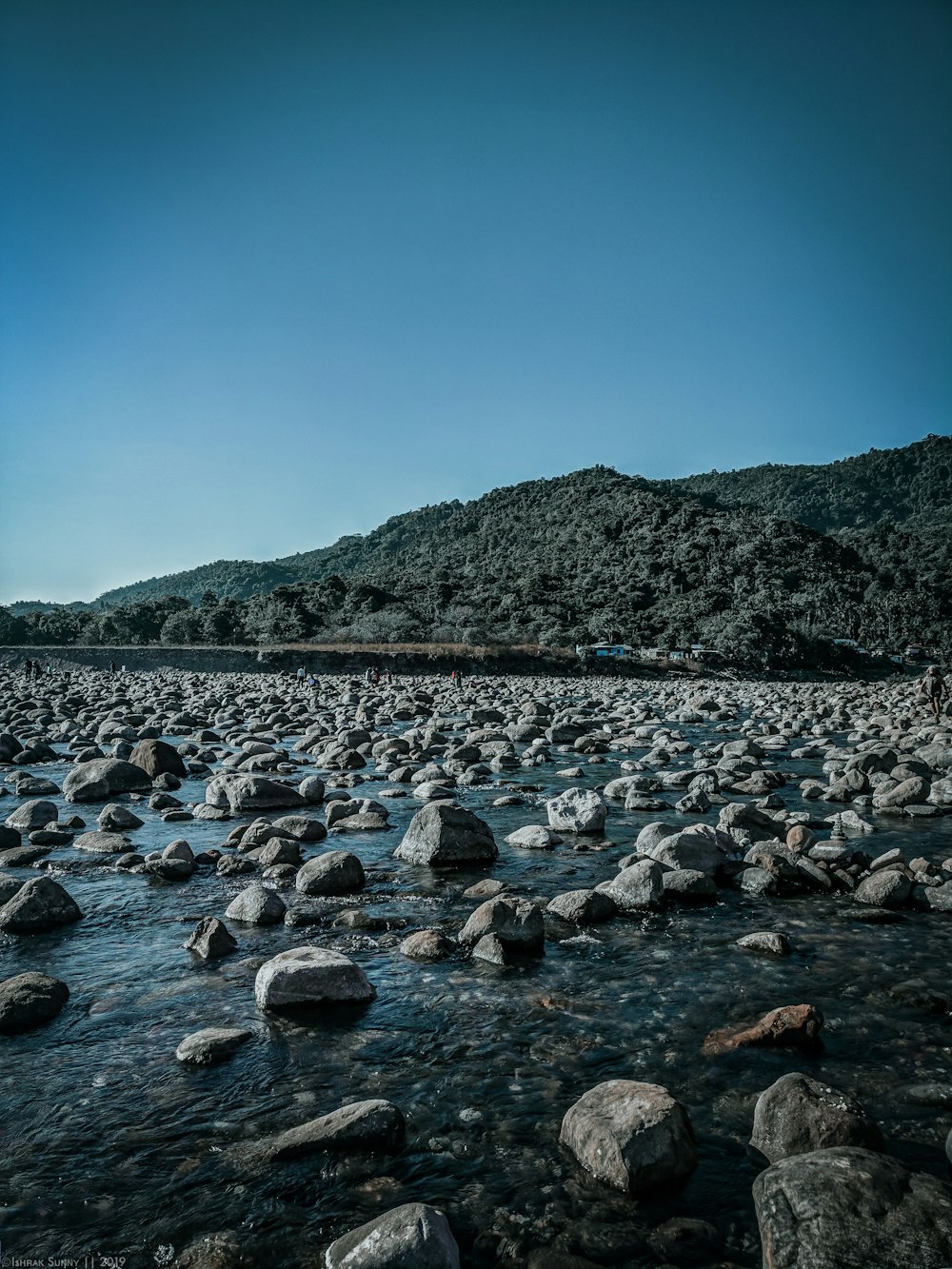 rocks on body of water