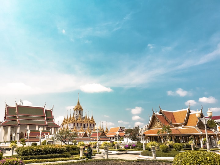A temple complex in Bangkok under a blue sky