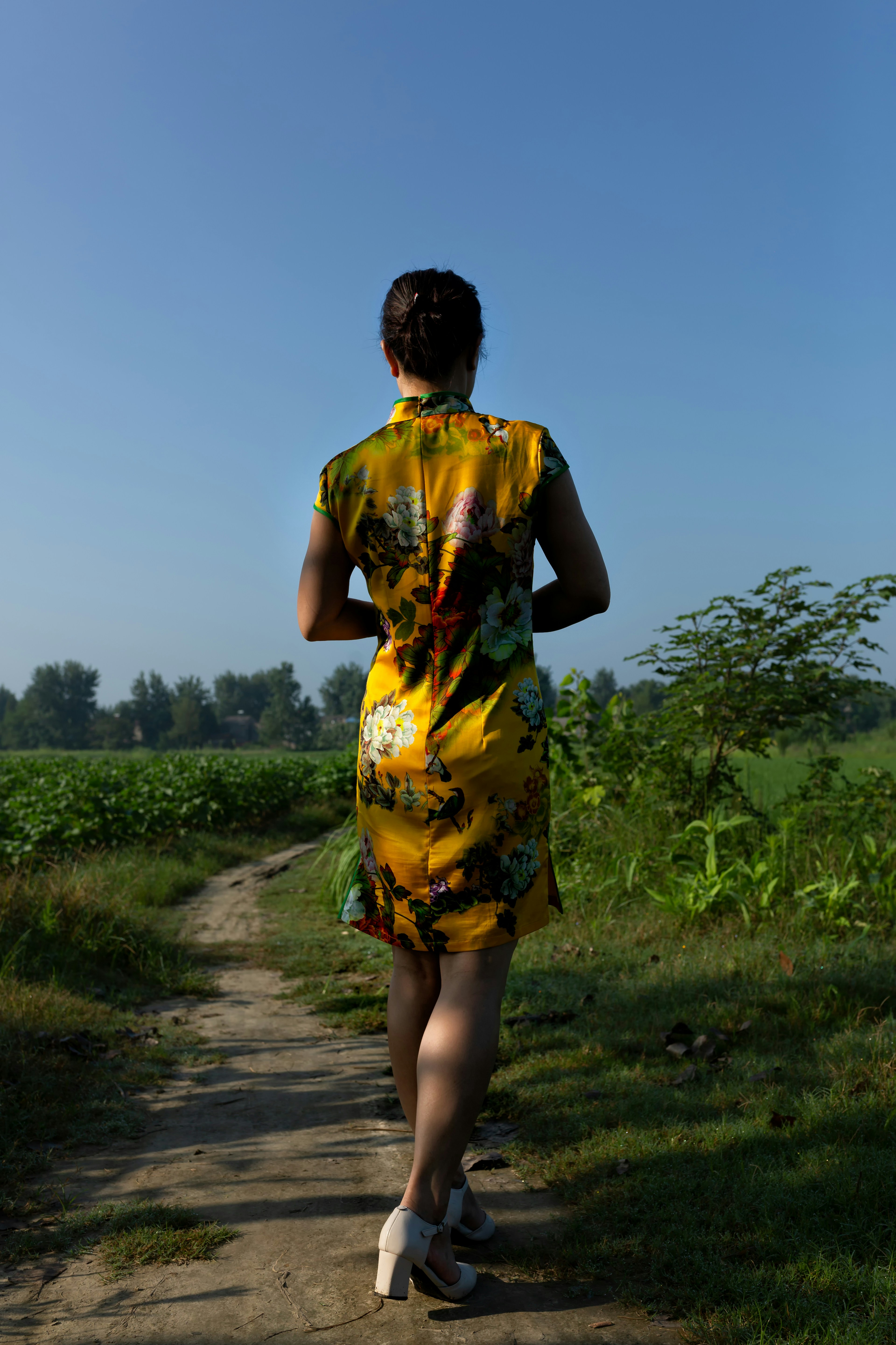woman wearing yellow floral dress