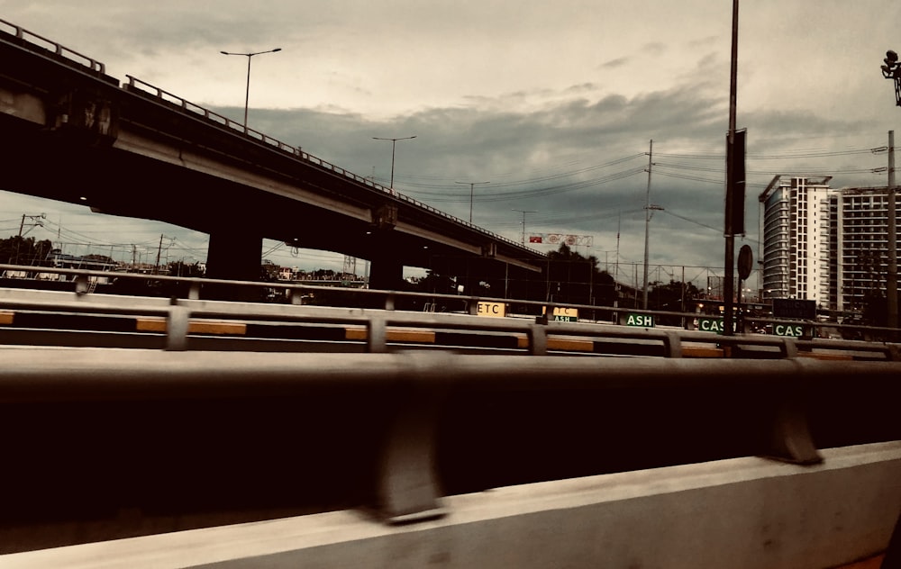 a view of a highway with a bridge in the background