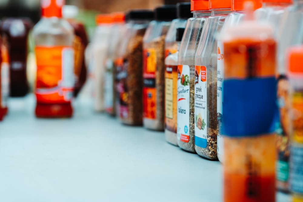 a variety of spices are lined up on a table