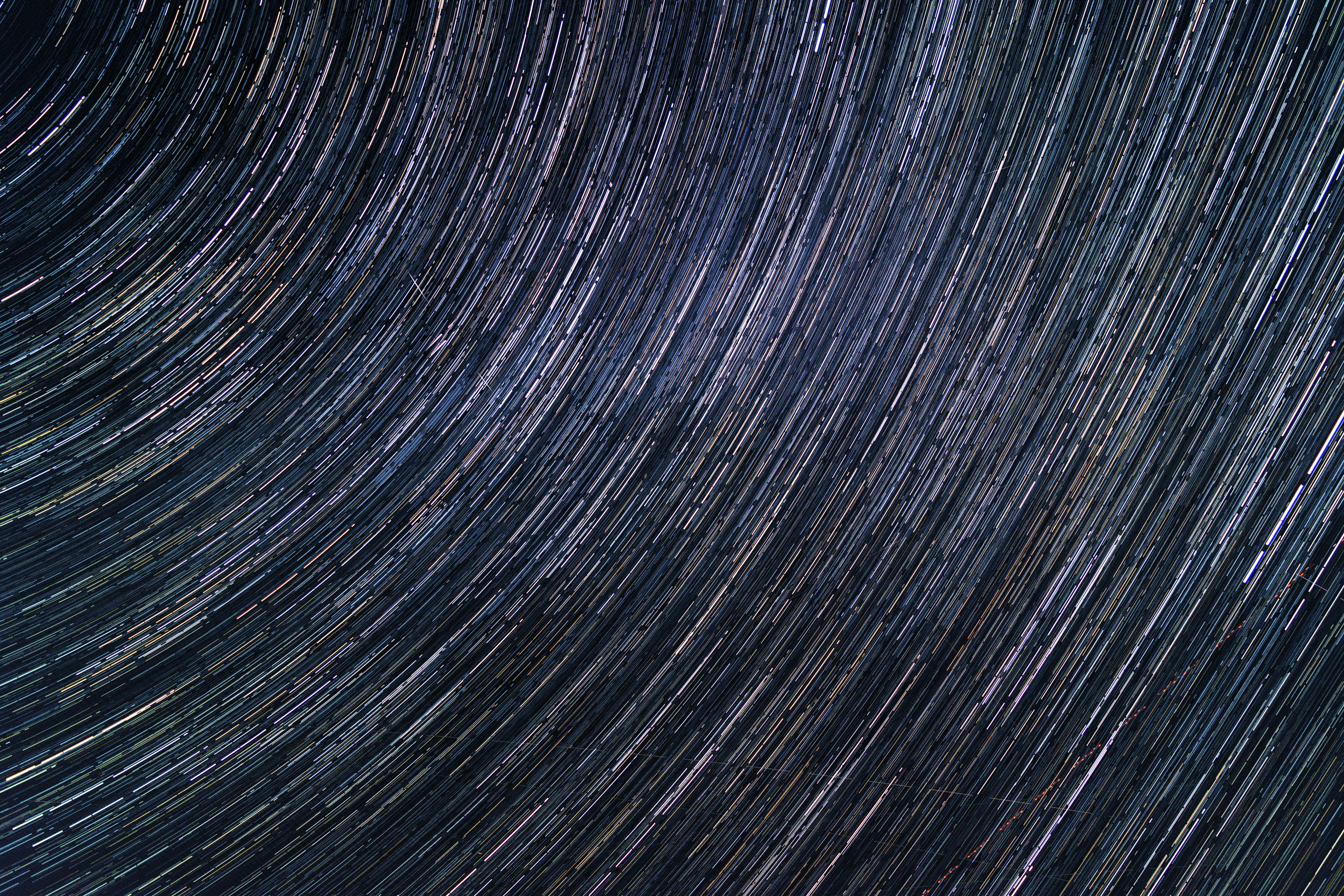 a star trail is seen in the night sky
