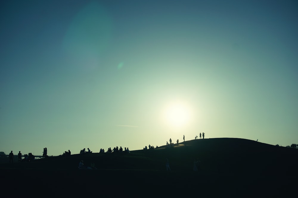 silhouette of people in hill