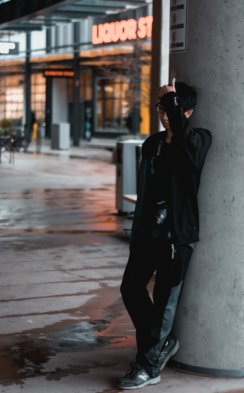 man leans on wall