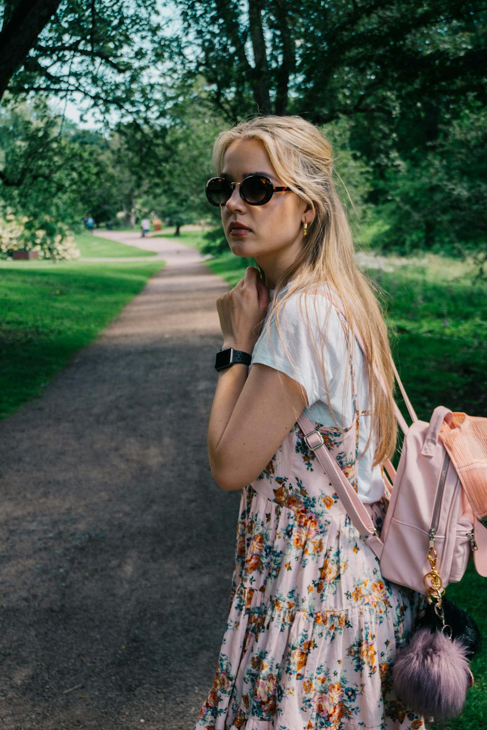 woman walking near trees