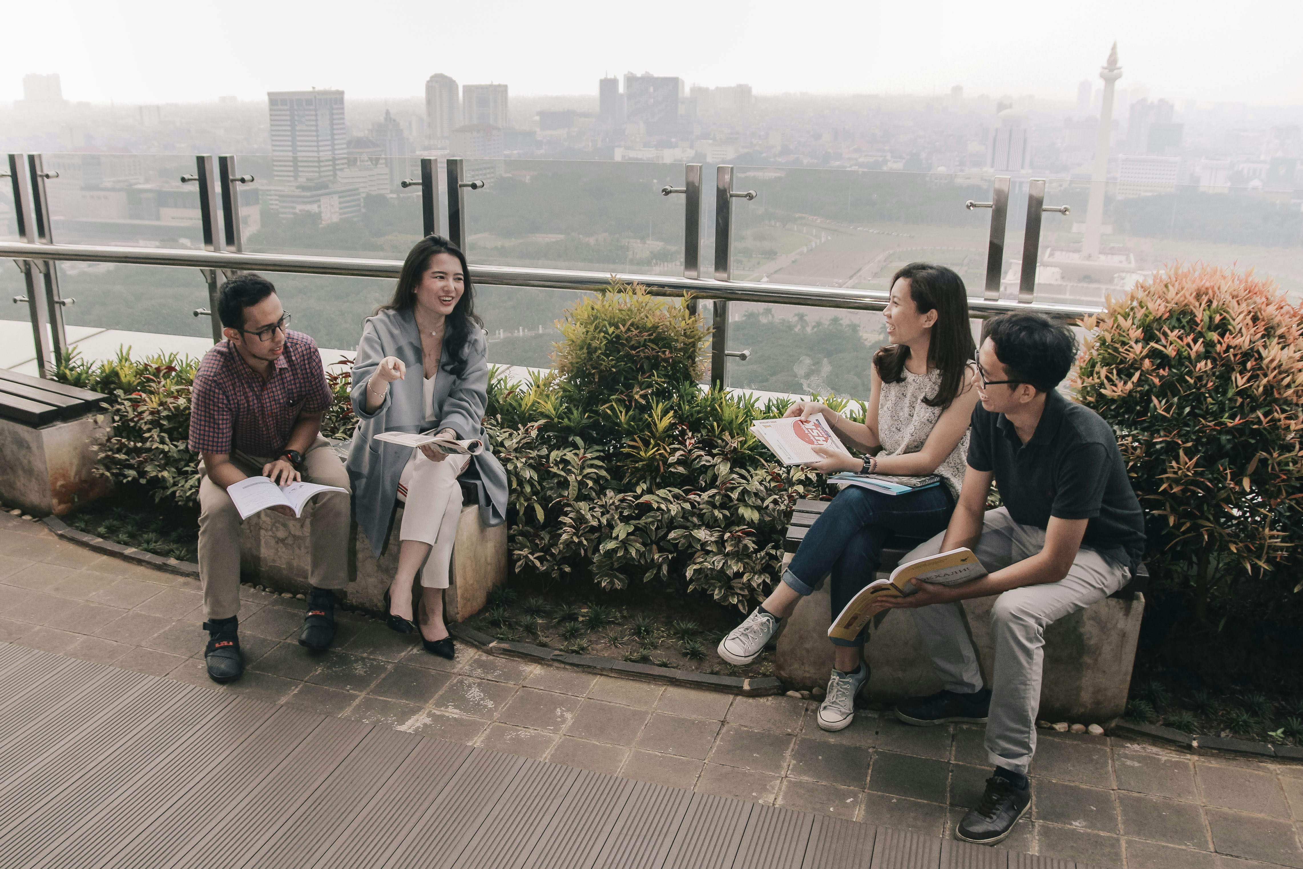 people sitting near green plants