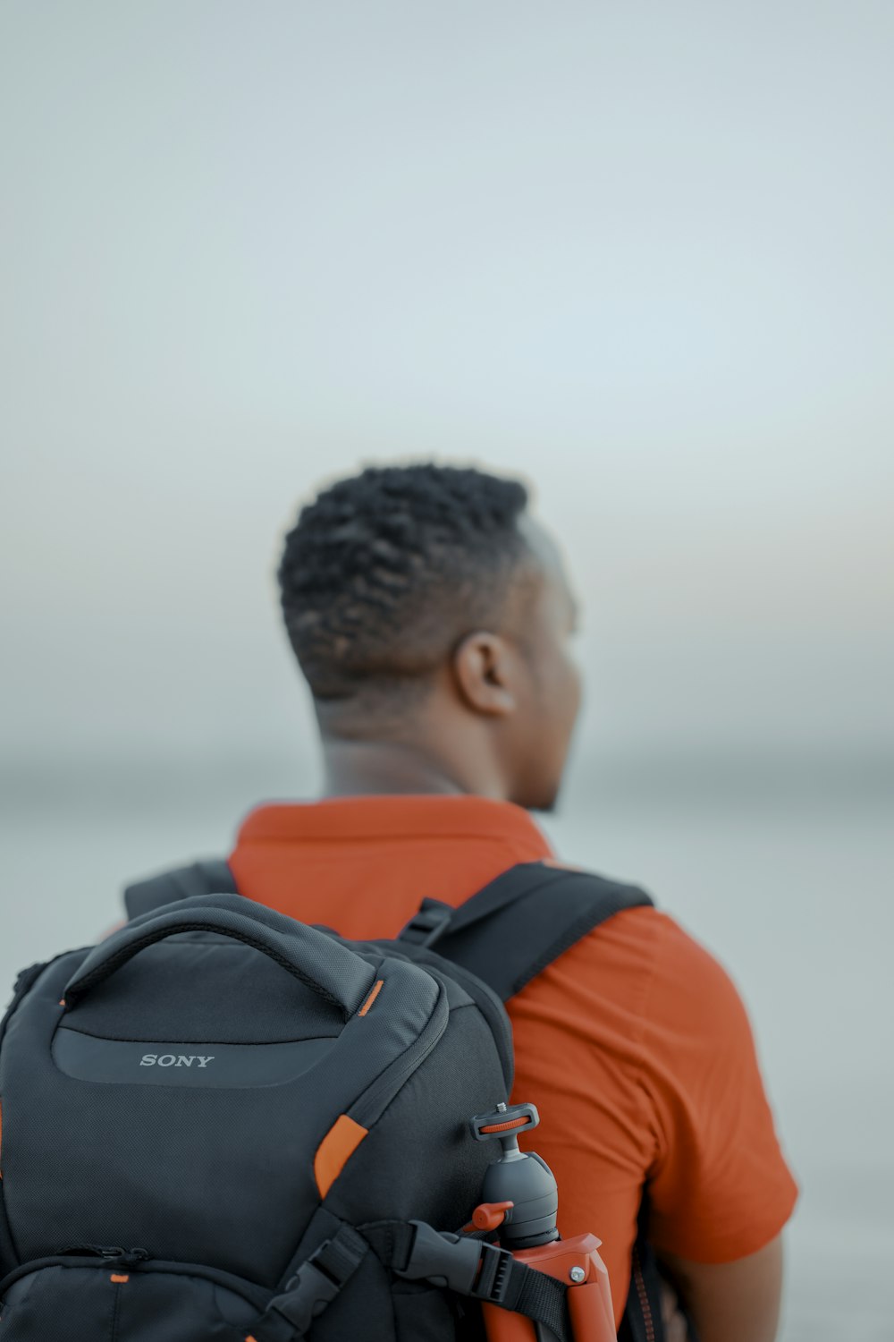 person wearing backpack close-up photography