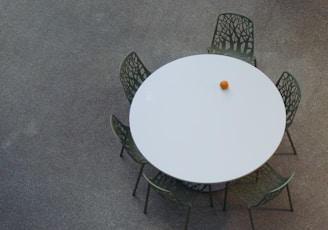 an overhead view of a table and chairs